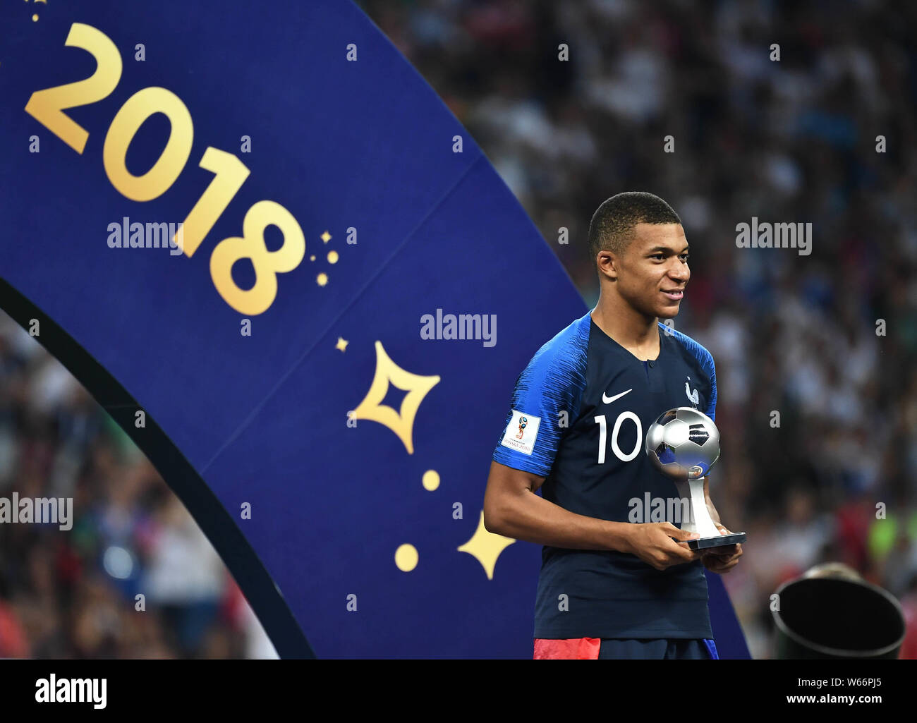 Kylian Mbappe of France poses with the trophy after France defeated Croatia in their final match during the 2018 FIFA World Cup in Moscow, Russia, 15 Stock Photo