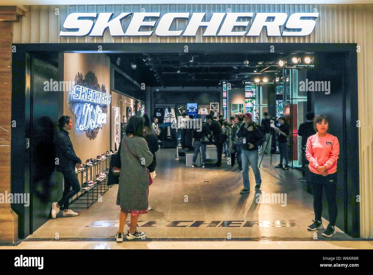 FILE--Customers shop at a branch of Global athleisure brand SKECHERS in  Shanghai, China, 28 October 2017. Global athleisure brand SKECHERS has see  Stock Photo - Alamy