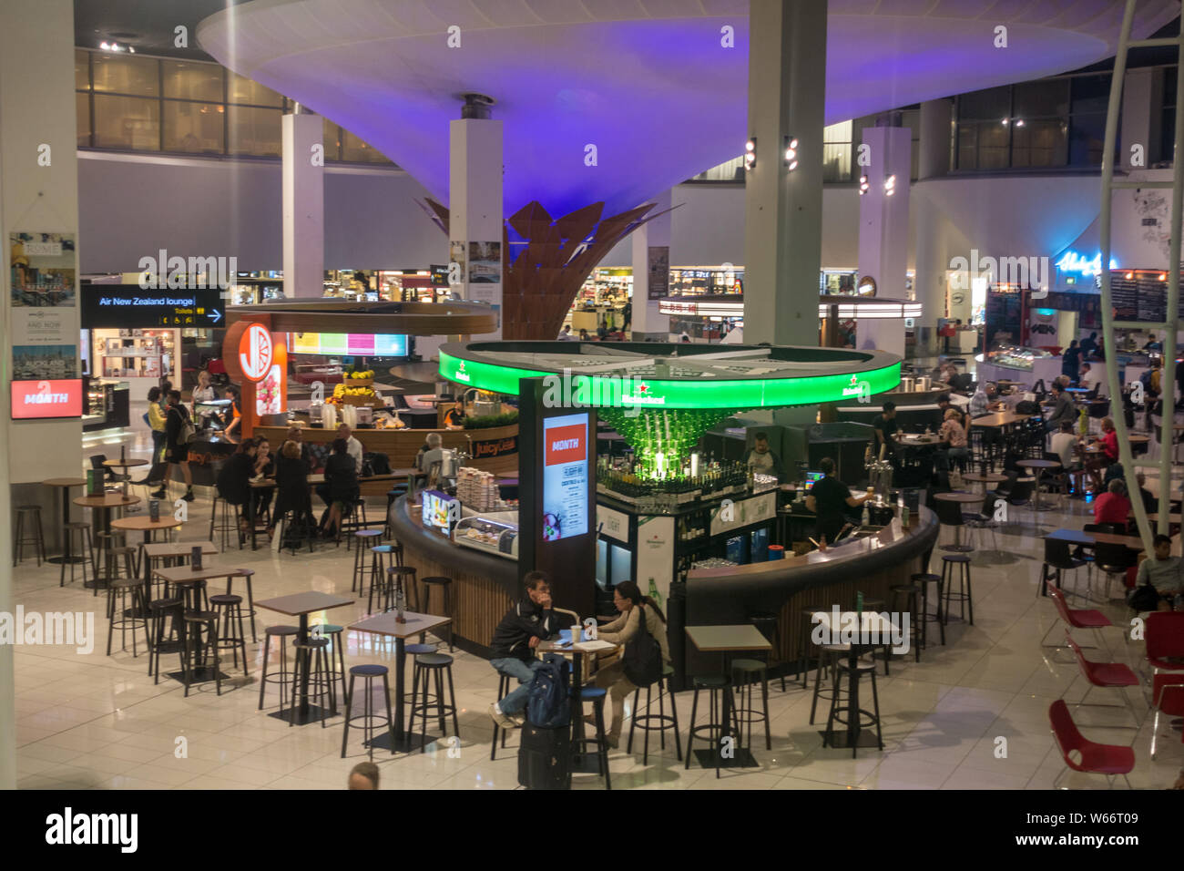 AUCKLAND - DEC 15 2016: Passengers passing through the new Auckland airport Stock Photo