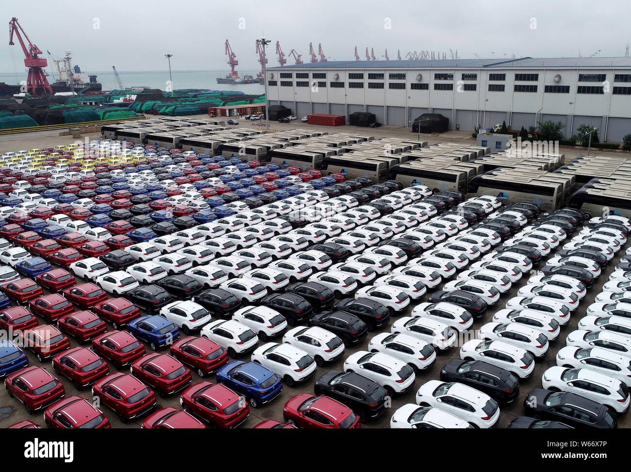Vehicles to be shipped to abroad are lined up on the quay of the Port of Lianyungang city, east China's Jiangsu province, 5 July 2018.   Auto sales in Stock Photo