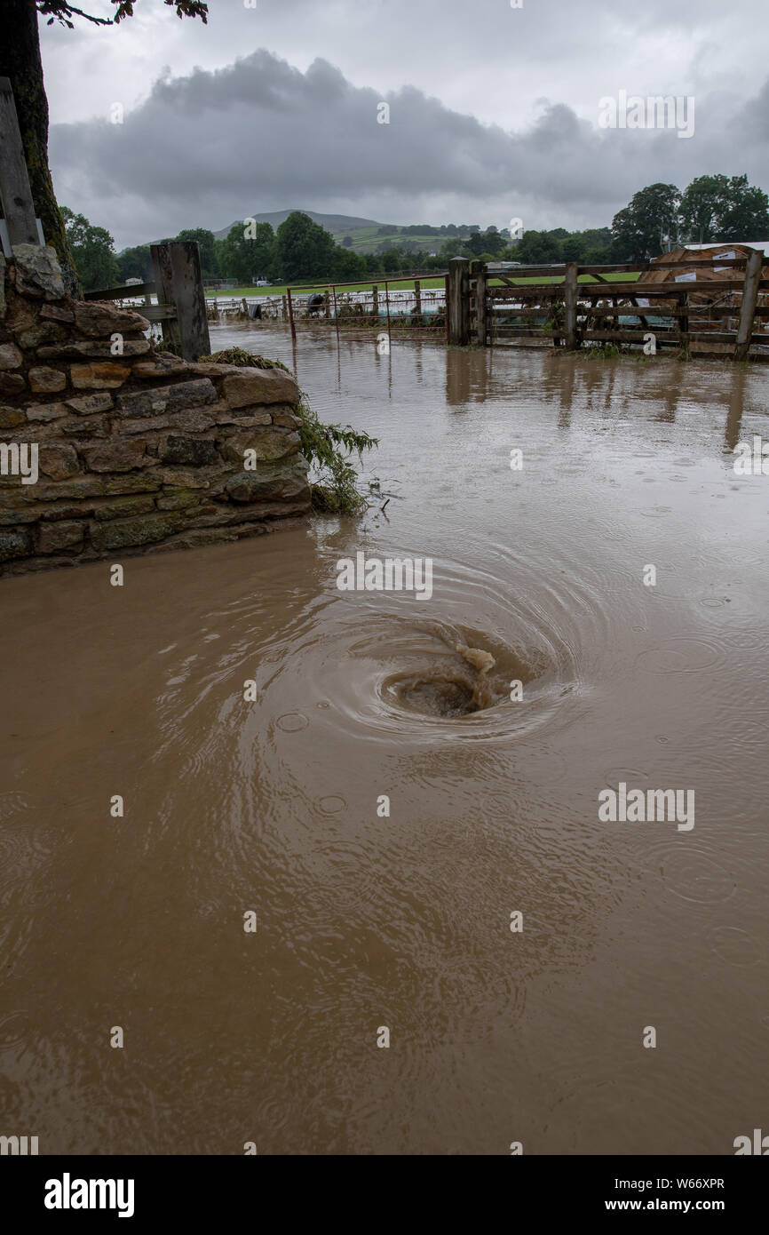 Swaledale, Yorkshire, UK. 31st Jul, 2019. Flash flood in Reeth and Fremington, Swaledale in the Yorkshire Dales National Park caused serious devastation and a full months worth of rain fell in less than 4 hours, sweeping away cars and flooding houses in the area. Credit: Wayne HUTCHINSON/Alamy Live News Stock Photo