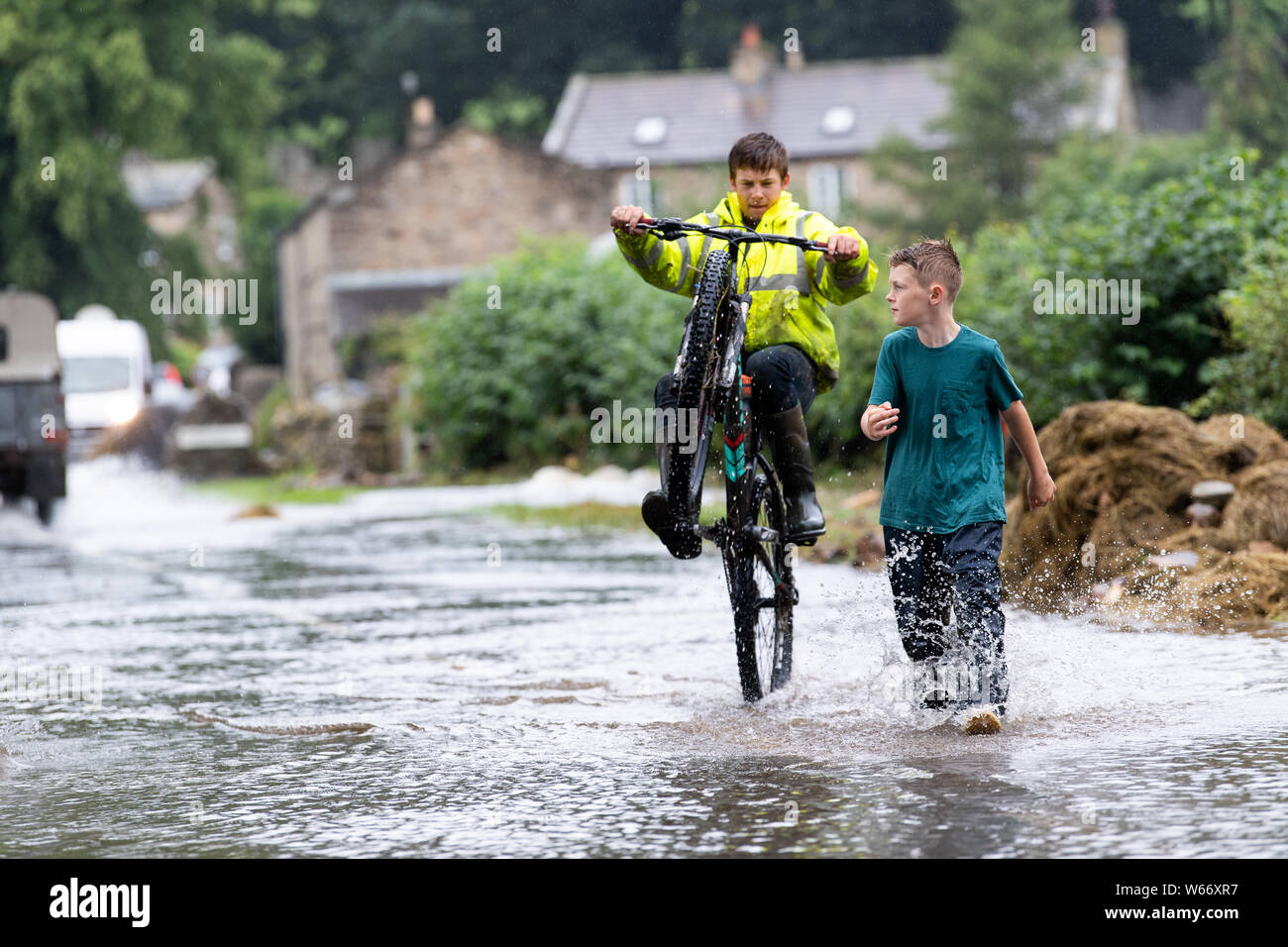 Swaledale, Yorkshire, UK. 31st Jul, 2019. Flash flood in Reeth and Fremington, Swaledale in the Yorkshire Dales National Park caused serious devestation and a full months worth of rain fell in less than 4 hours, sweeping away cars and flooding houses in the area. Credit: Wayne HUTCHINSON/Alamy Live News Stock Photo