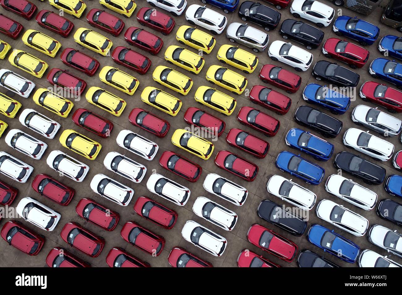 Vehicles to be shipped to abroad are lined up on the quay of the Port of Lianyungang city, east China's Jiangsu province, 5 July 2018.   Auto sales in Stock Photo