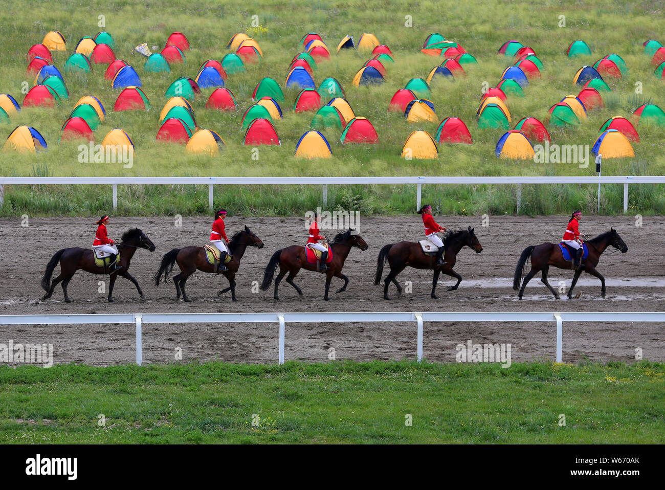 Participants compete in a horse racing in Zhaosu county, Ili Kazakh Autonomous Prefecture, northwest China's Xinjiang Uyghur Autonomous Region, 17 Jul Stock Photo