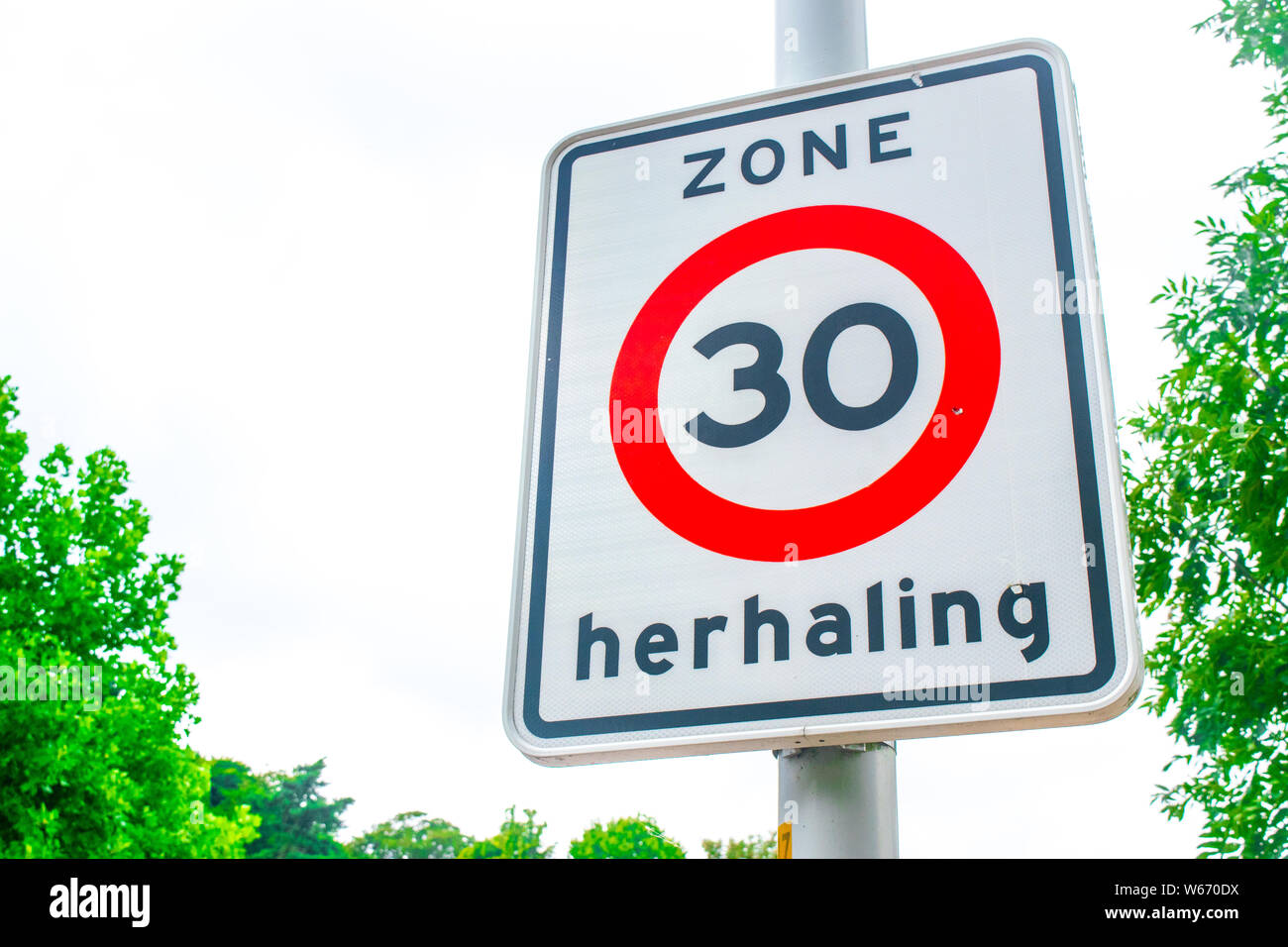 Dutch Traffic sign: 30 km/h speed limit, it is forbidden to drive ...