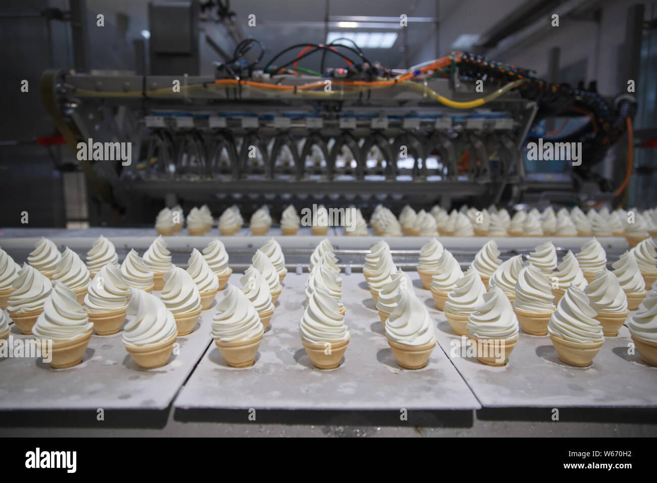 Yili torch ice creams are being produced on the assembly line at a