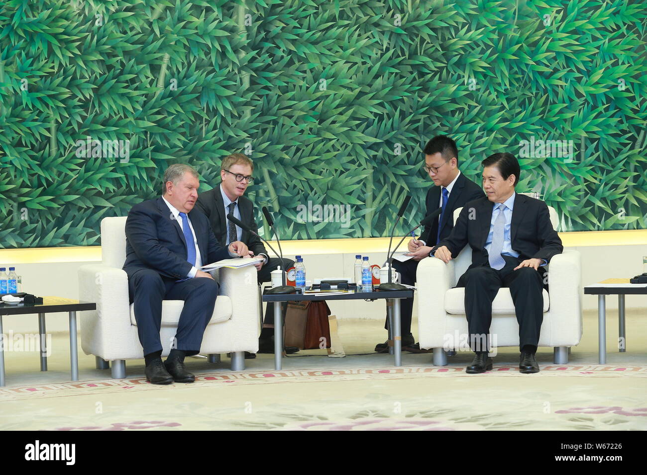 Igor Ivanovich Sechin, the Chief Executive Officer of Rosneft, left, and Chinese Minister of Commerce Zhong Shan attend a meeting in Beijing, China, 6 Stock Photo