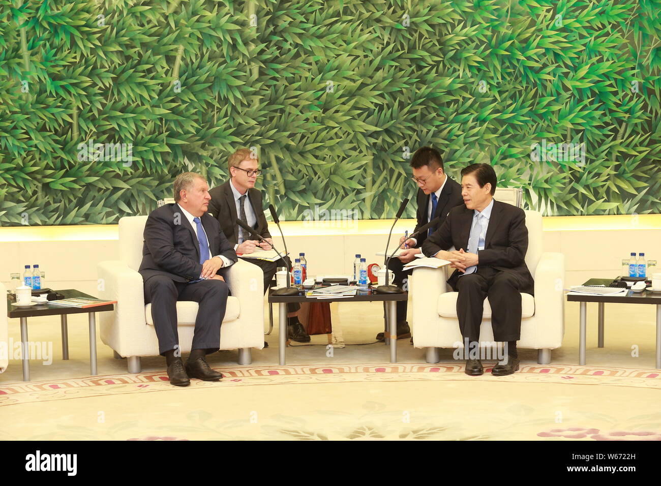 Igor Ivanovich Sechin, the Chief Executive Officer of Rosneft, left, and Chinese Minister of Commerce Zhong Shan attend a meeting in Beijing, China, 6 Stock Photo