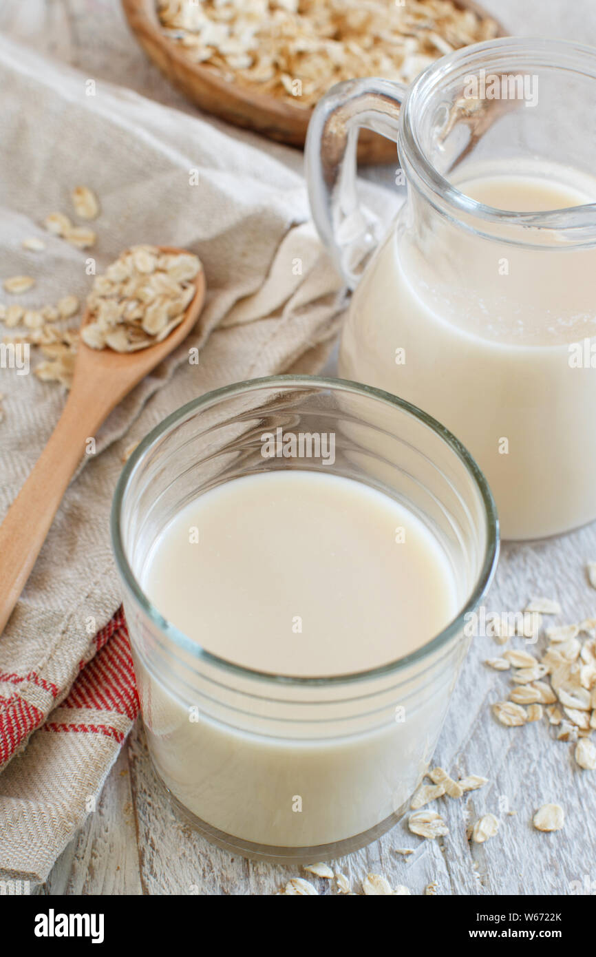 Vegan oat milk, non dairy alternative milk in a small bottle close up