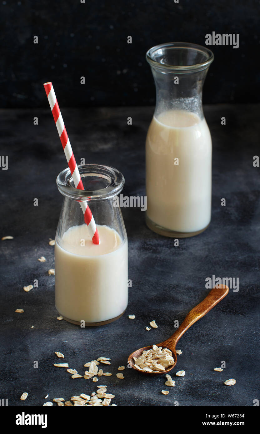 Vegan oat milk, non dairy alternative milk in a small bottles close up Stock Photo