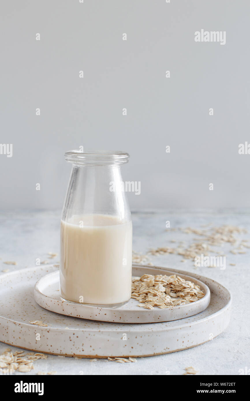 Vegan oat milk, non dairy alternative milk in a small bottle close up Stock Photo