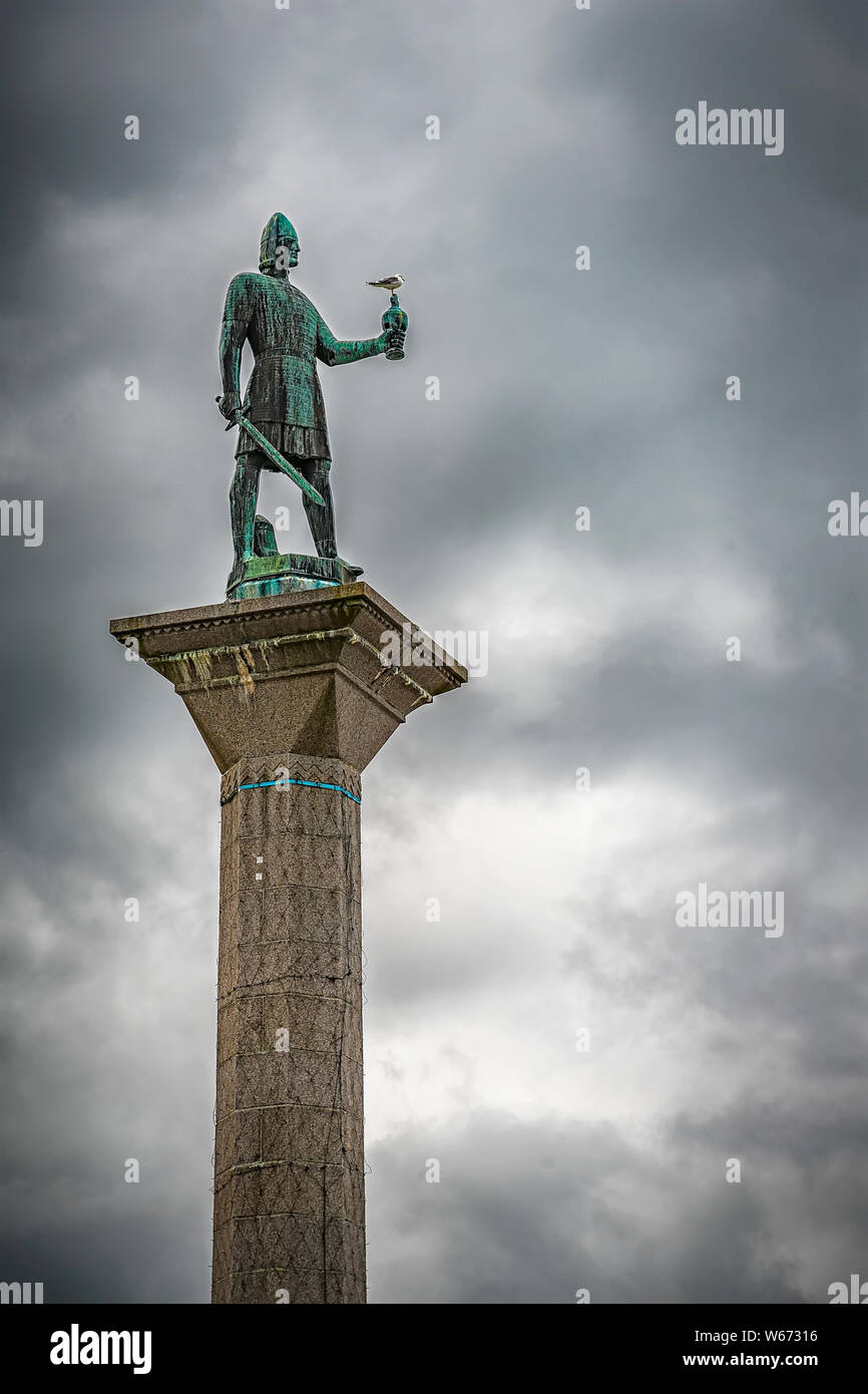 The 18-metre statue of Olav Tryggvason is mounted on top of an obelisk. It stands at the center of the city square at the intersection of the two main Stock Photo