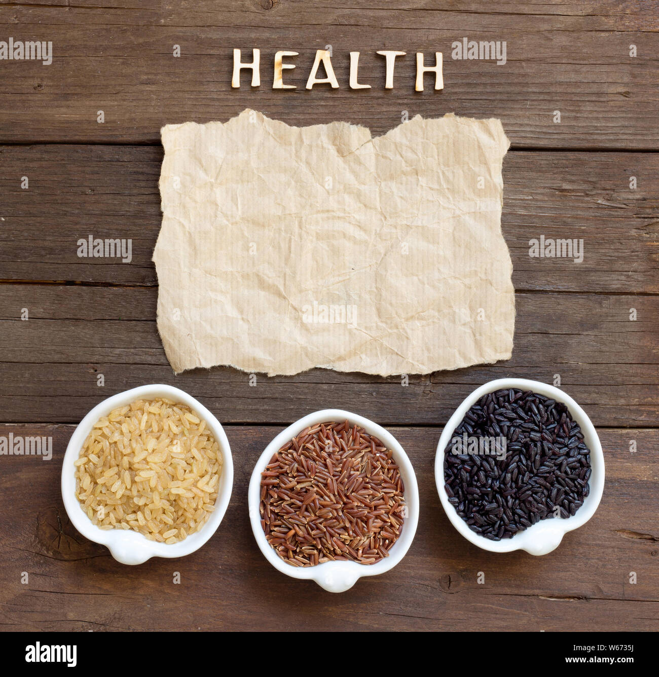 Variety of rice with craft paper and word Health Stock Photo - Alamy