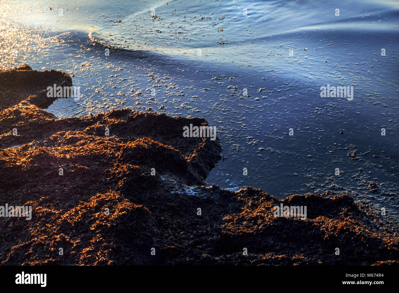 April Baltic sea coast at sunset for romantic mood Stock Photo