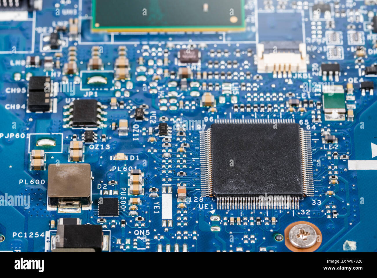 Old electronic circuit board with processor. Selective focus Stock Photo