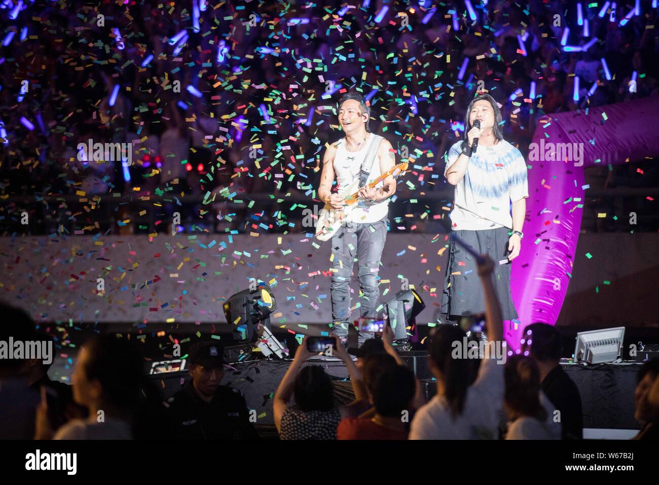 Masa (Matthew Tsai Shen-yen), right, and Stone (Shi Chin-hang) of Taiwanese rock band Mayday perform at the Life Tour 2018 Concert in Shanghai, China, Stock Photo