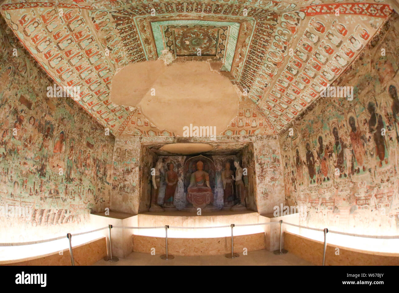 View of the replica of frescoes in the No. 285 grotto of the Mogao ...
