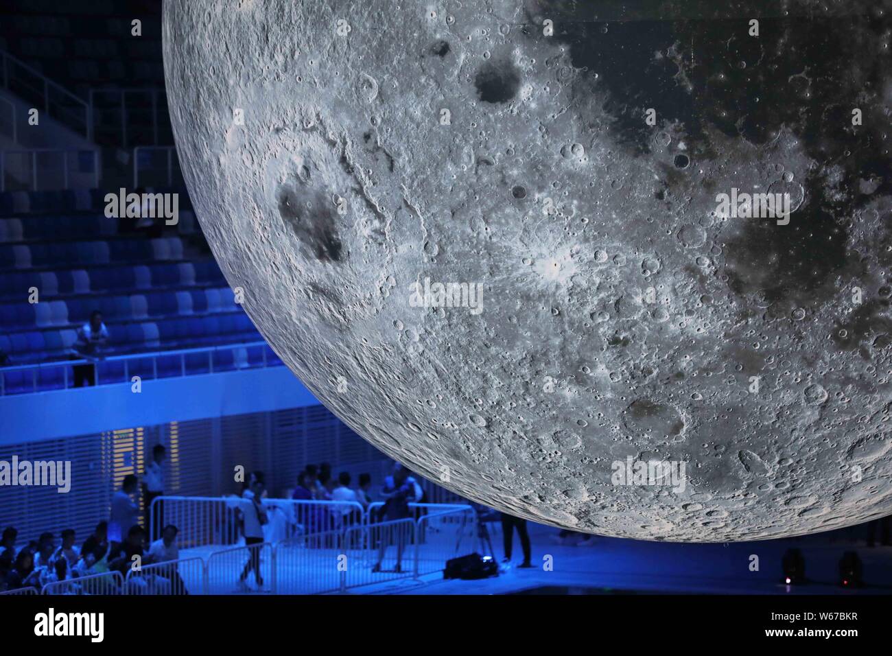 Large Moon Model Visitors view a huge moon model during an exhibition on moon held at ...