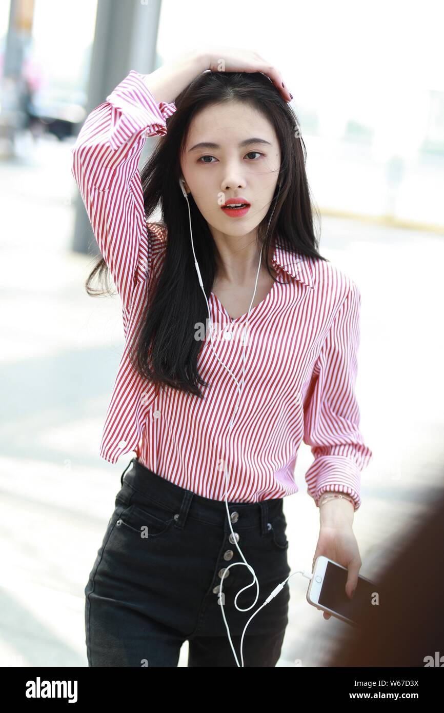 Chinese singer and actress Ju Jingyi arrives at the Shanghai Hongqiao International Airport before departure in Shanghai, China, 30 July 2018.   Jeans Stock Photo