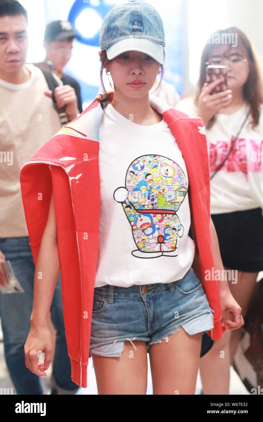Taiwanese singer Jolin Tsai dressed in a Uniqlo Doraemon X Takashi Murakami  UT is pictured at the Beijing Capital International Airport in Beijing, Ch  Stock Photo - Alamy
