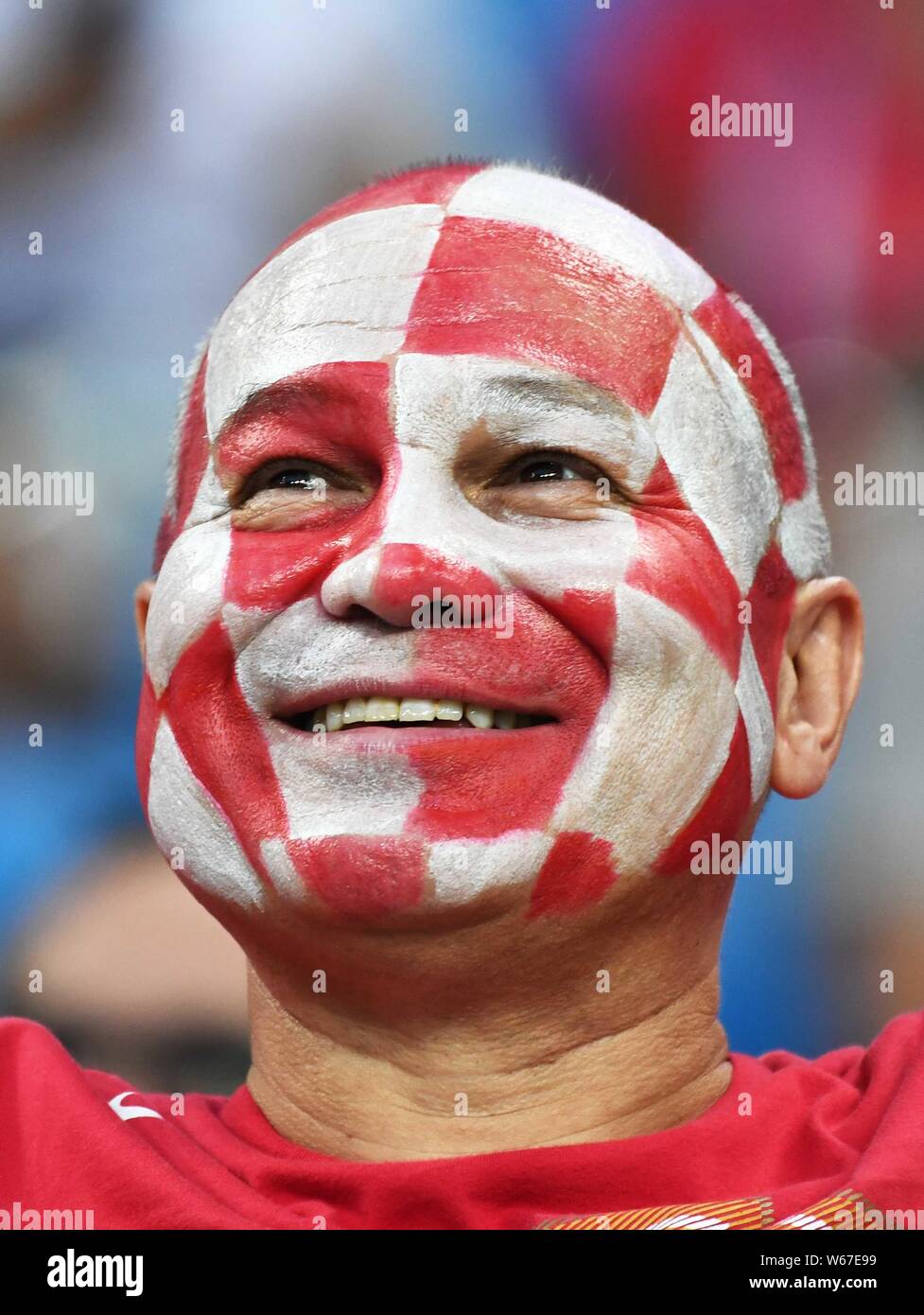 A Croatian Football Fan Is Painted With The National Flag On