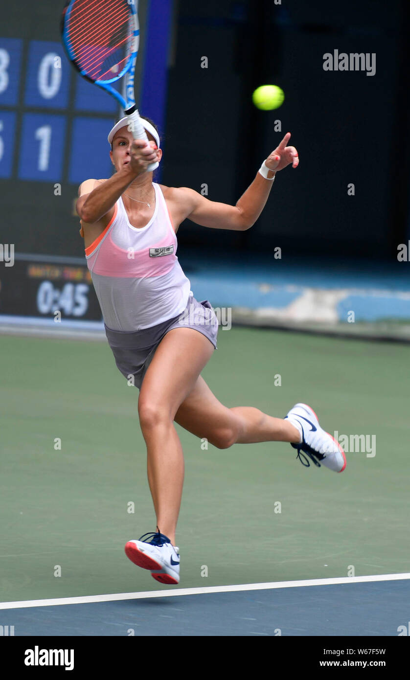 Magda Linette of Poland returns a shot to Liang En-shuo of Chinese Taipei  in their women's quarter-final match during the 2018 WTA Jiangxi Open tennis  Stock Photo - Alamy