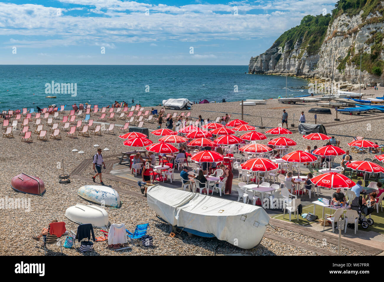 Beer, South East Devon, England. With blue skies and a gentle breeze, the beach at the picturesque seaside village of Beer sees fewer holidaymakers si Stock Photo