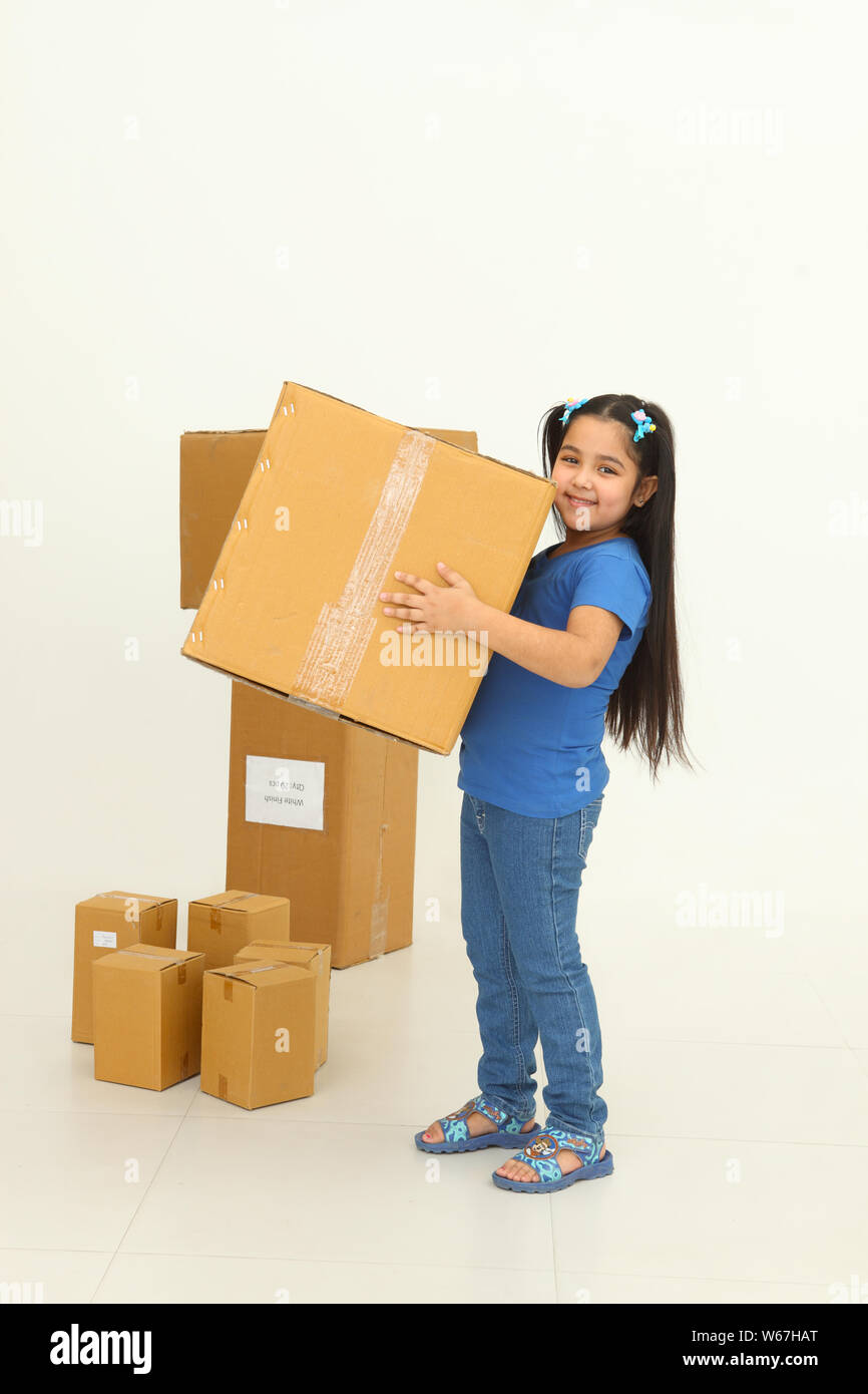 Girl carrying cardboard Box Stock Photo