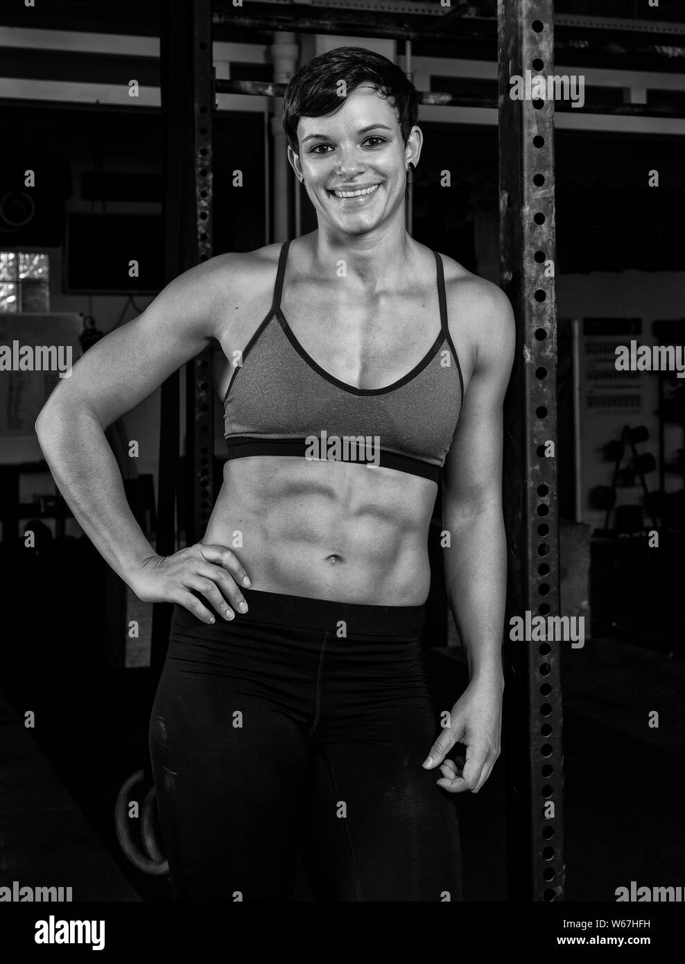 Beautiful female abs in gym Stock Photo - Alamy