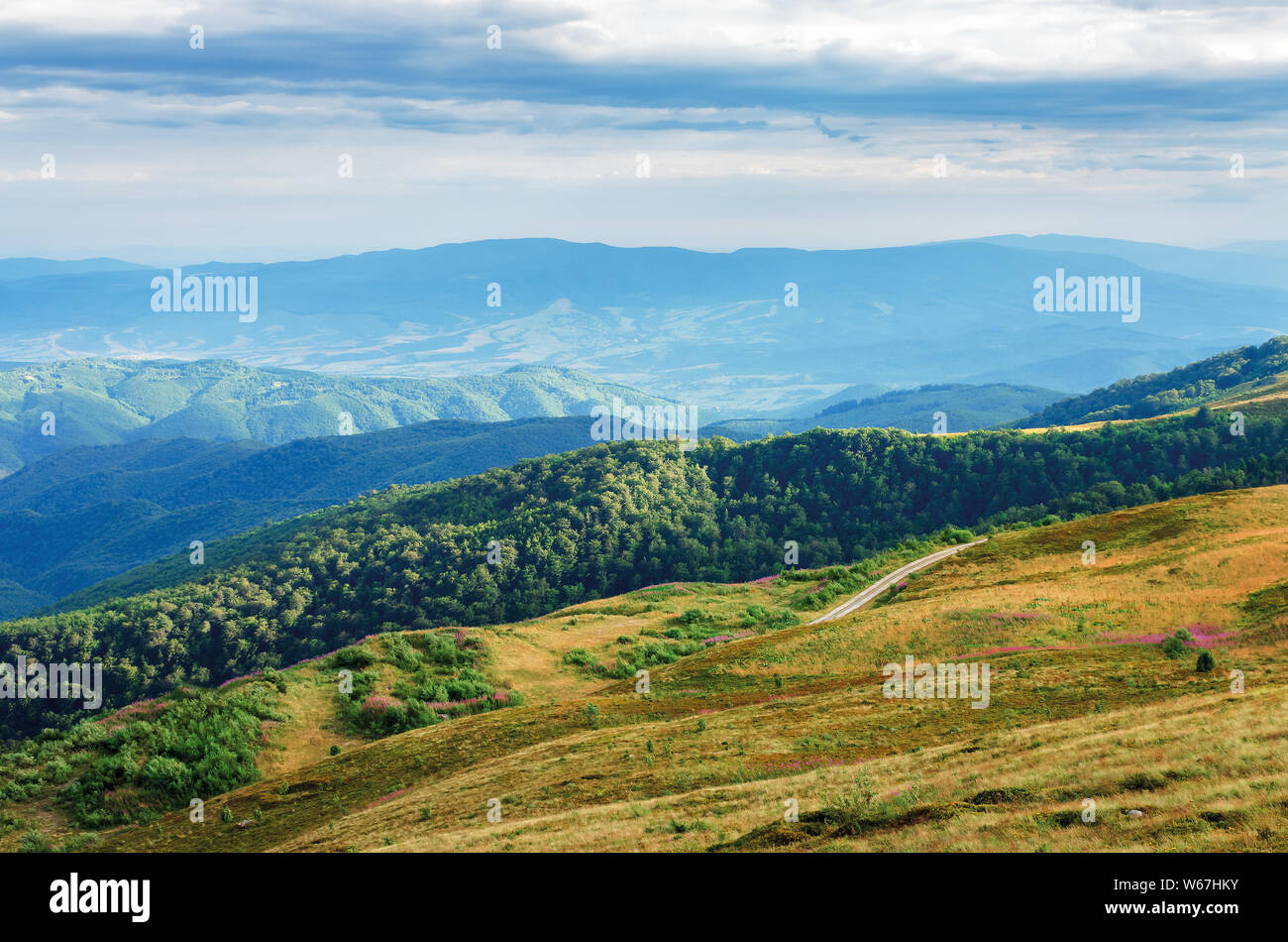 beautiful mountain landscape. view from the top of a hill in to ...