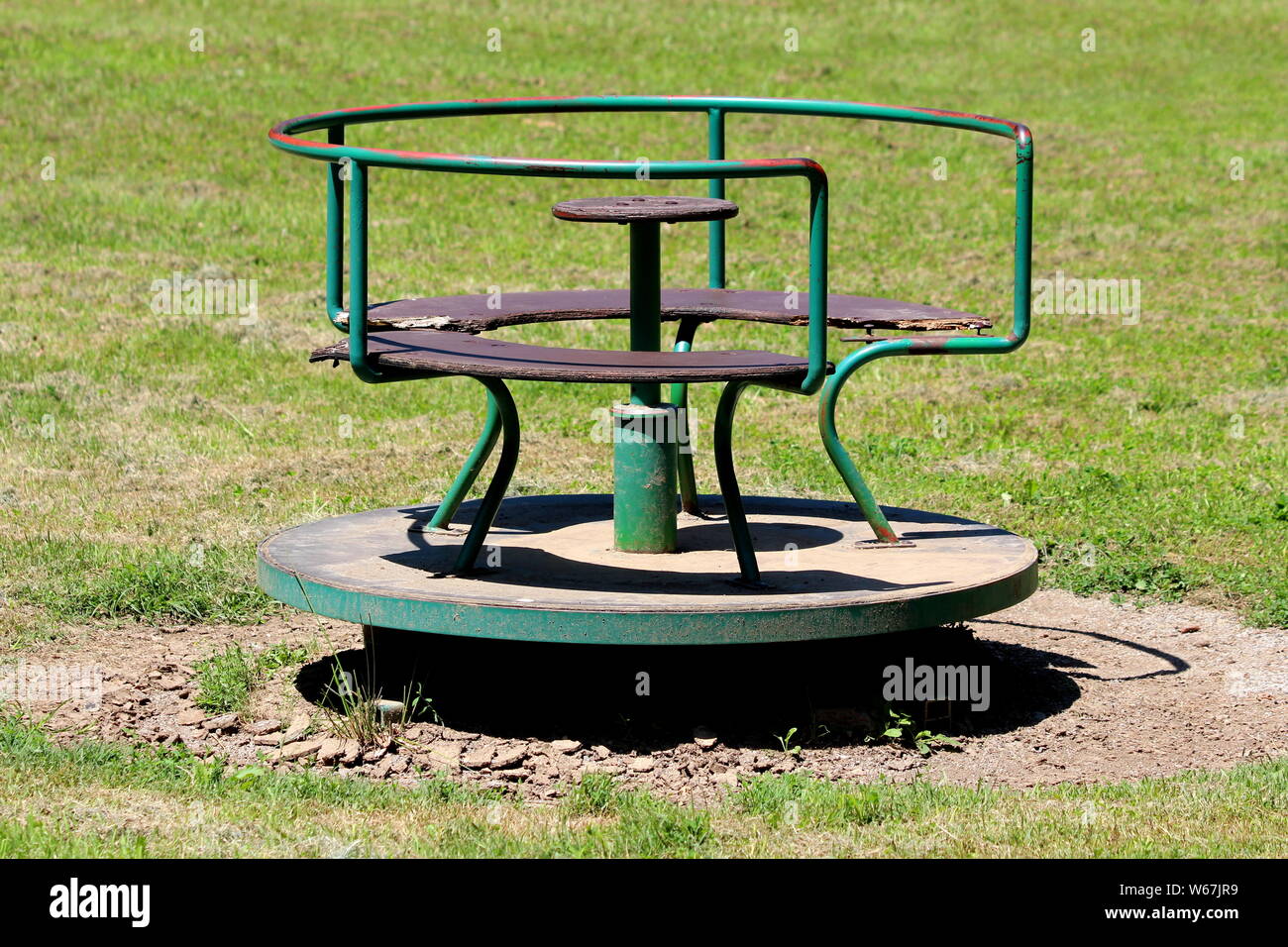 Old vintage retro partially rusted outdoor public playground equipment