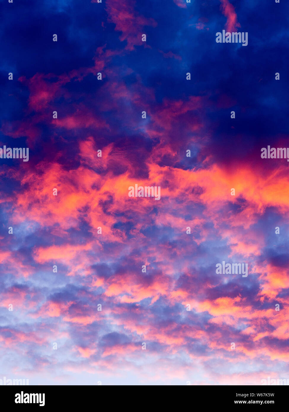 Sky at sunset with pink/orange clouds Stock Photo