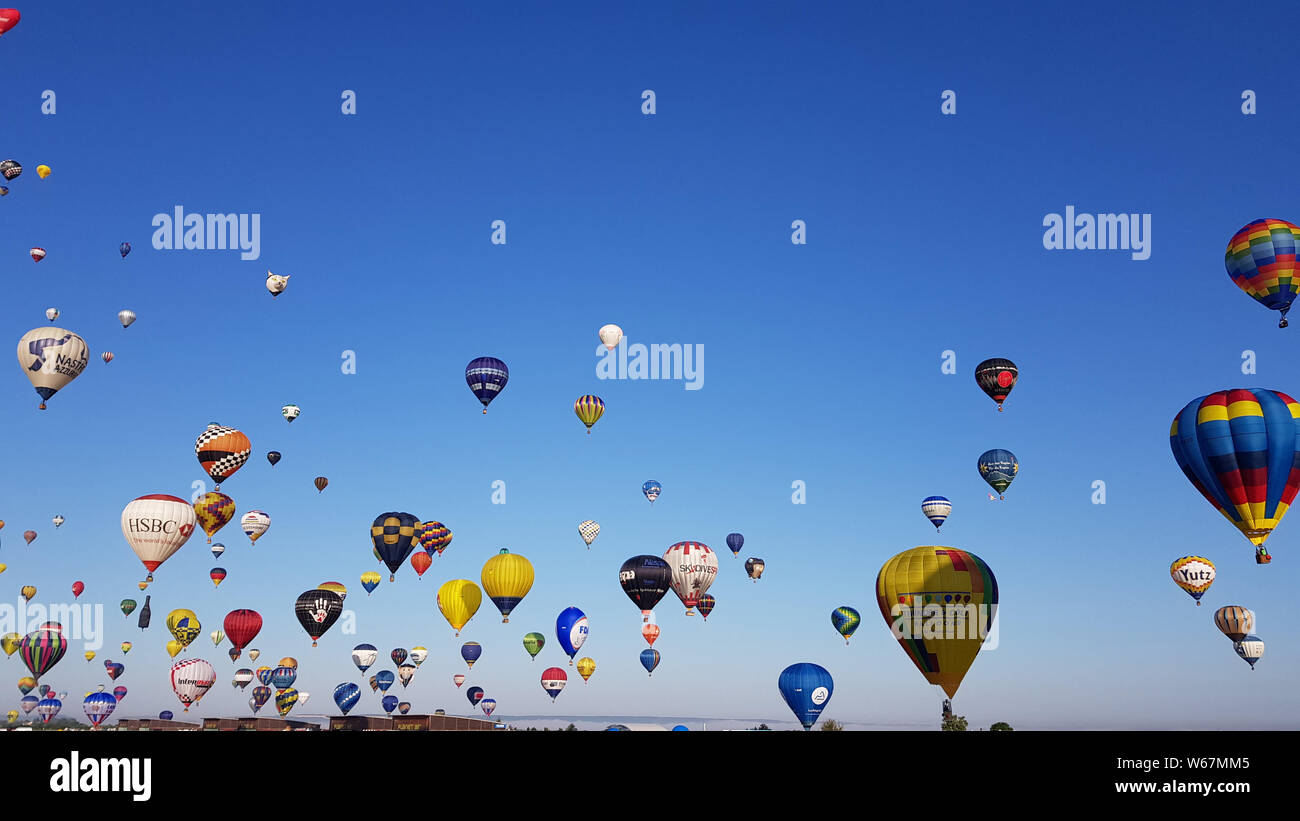 More than 400 hot-air balloons attempted to break the simultaneous take-off world record in the Grand Est Mondial Air Ballons festival at Chambley-Bussières airbase in eastern France, on July 29th  2019. The gathering attracts more than 1,000 hot-air balloons from all over the world and is the biggest meeting in the world. Stock Photo