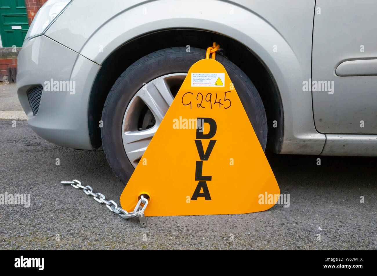 DVLA Wheel Clamp fitted to a UK car which does not have paid road tax insurance or annual MOT