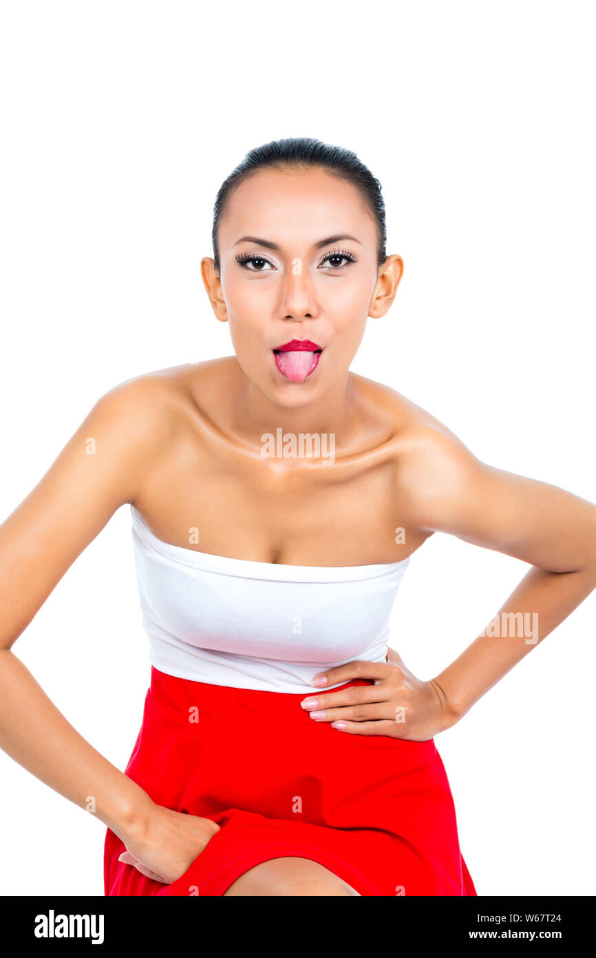 Young Asian sticking tonout out naughty Stock Photo