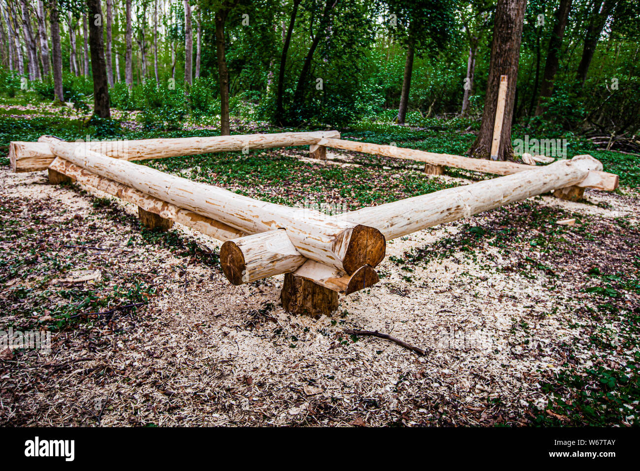 Building a log house with chainsaw and traditional carpenter tools in Grevenbroich, Germany Stock Photo