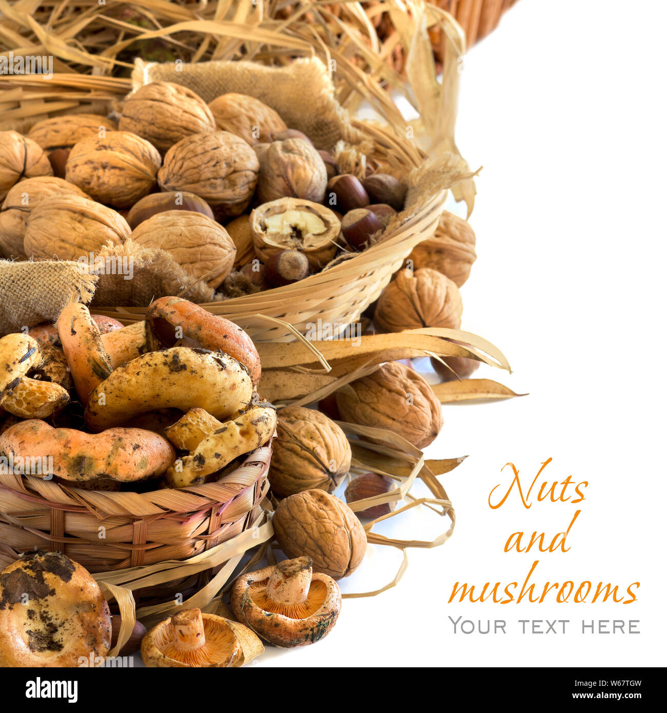 Various nuts and mushrooms in baskets - autumn background Stock Photo