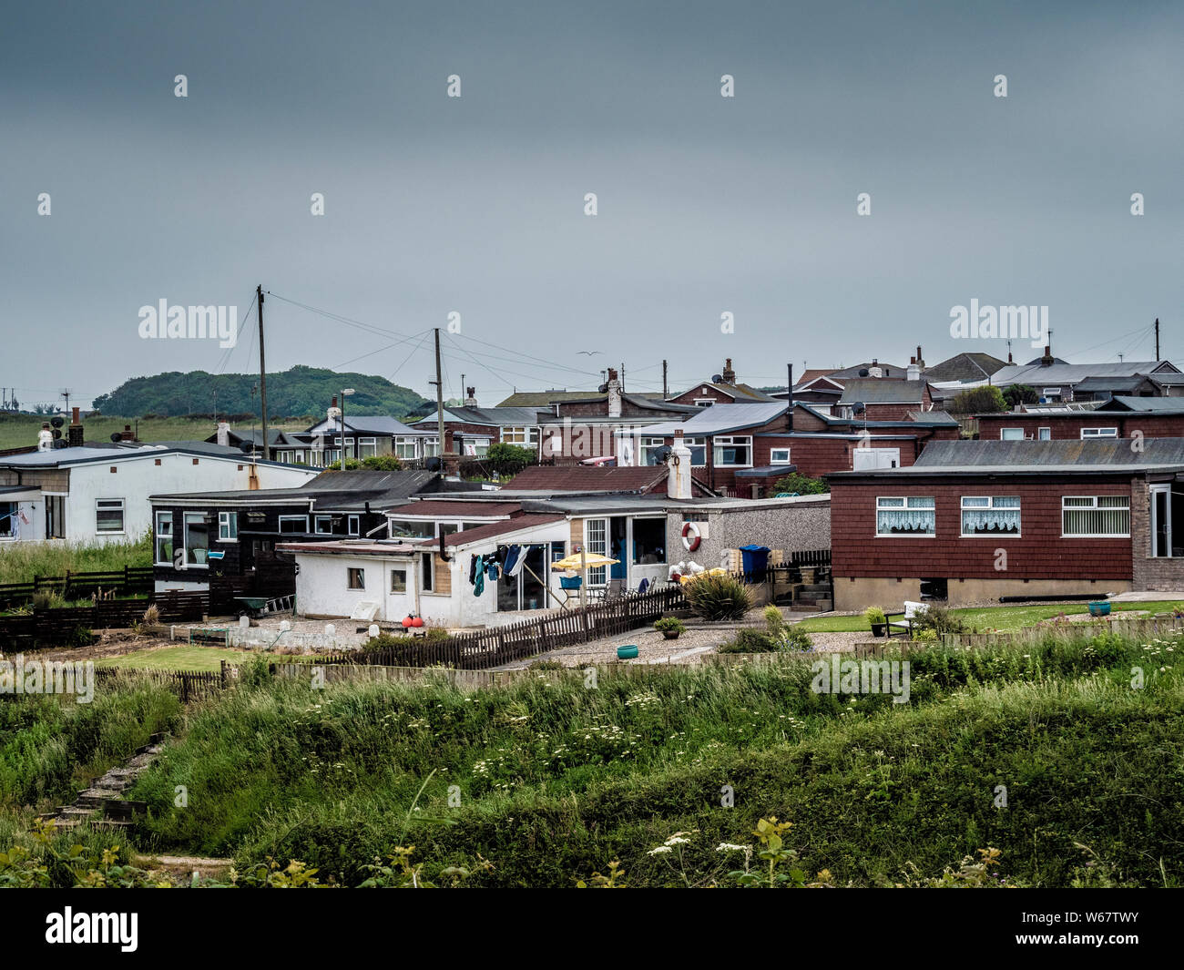 Holiday homes on top of cliff at North Landing, Flamborough, Yorkshire, UK. Stock Photo