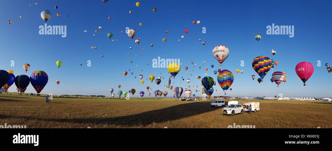 More than 400 hot-air balloons attempted to break the simultaneous take-off world record in the Grand Est Mondial Air Ballons festival at Chambley-Bussières airbase in eastern France, on July 29th  2019. The gathering attracts more than 1,000 hot-air balloons from all over the world and is the biggest meeting in the world. Stock Photo