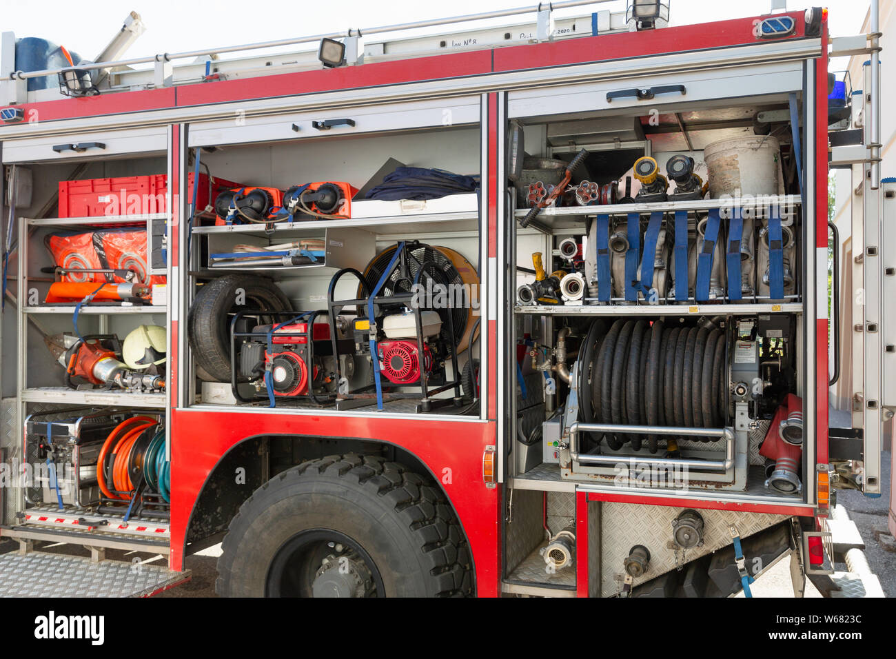 Part of equipment of a firetruck: hoses and syringe of a water cannon Stock Photo