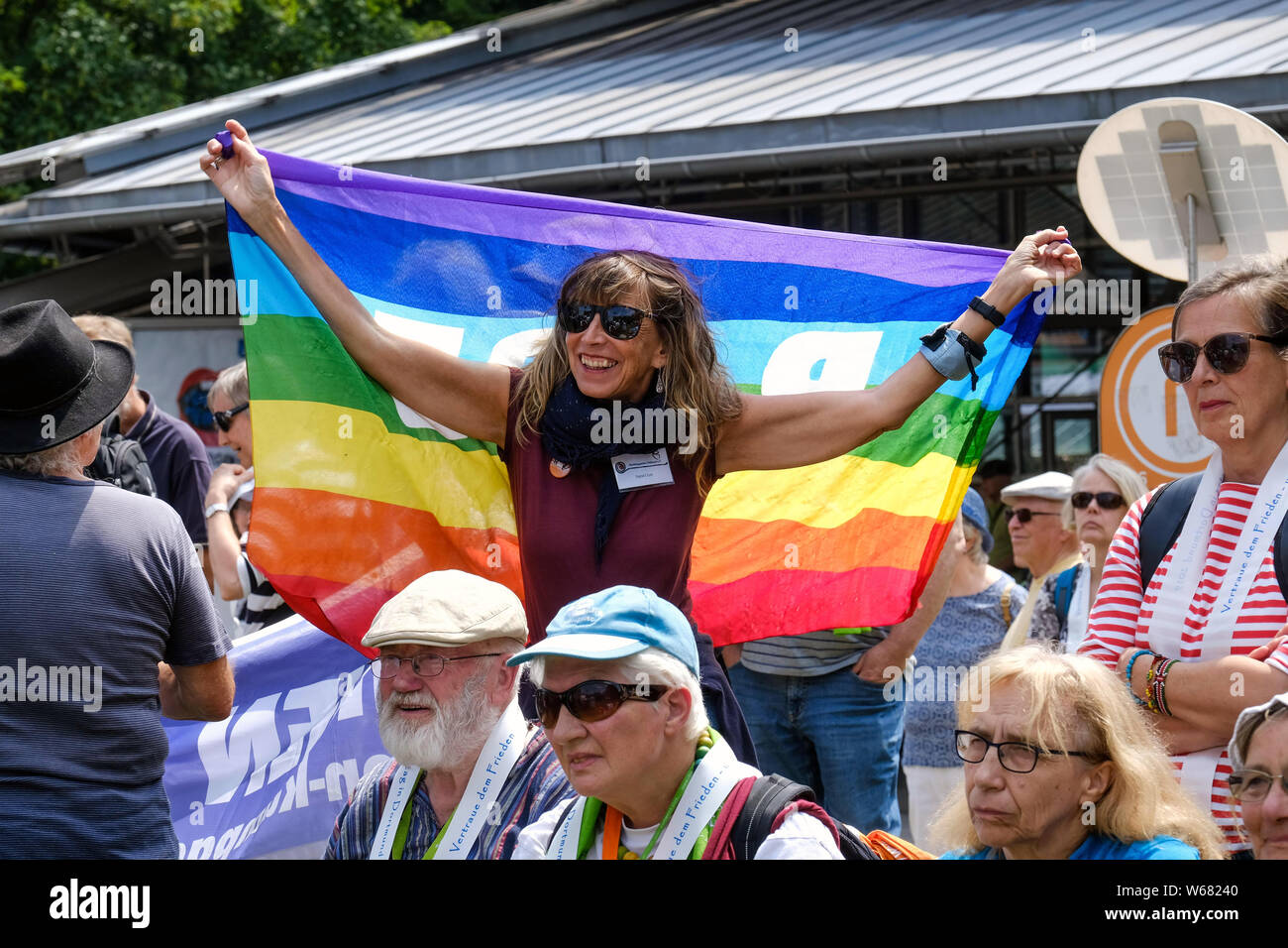 Peace activists with flag with the slogan 'PACE' during a peace demonstration at the German Protestant Church Congress 2019 in Dortmund, Germany Stock Photo