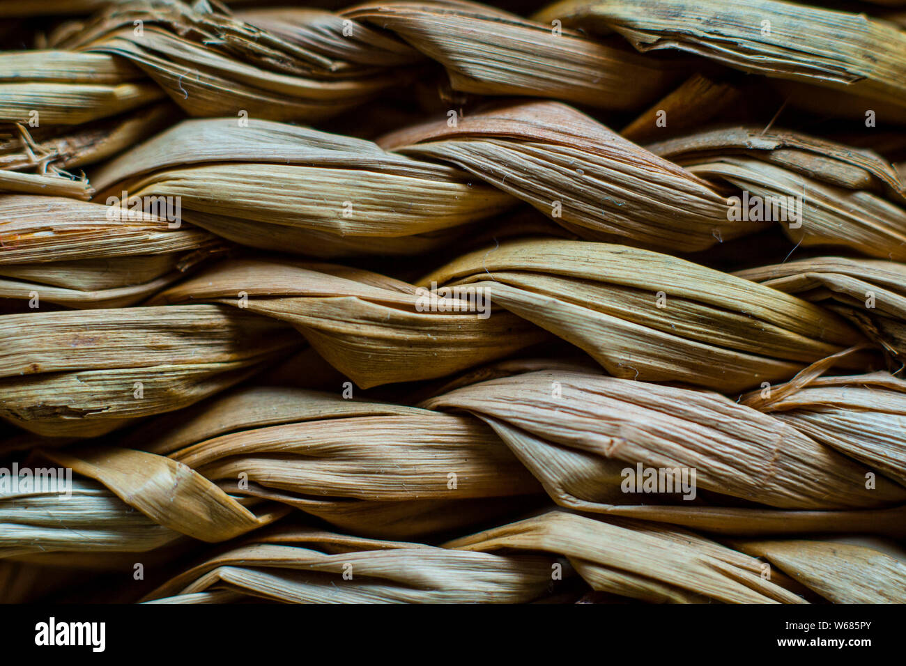 Macro closeup on weave of natural straw table mat round braided Stock Photo