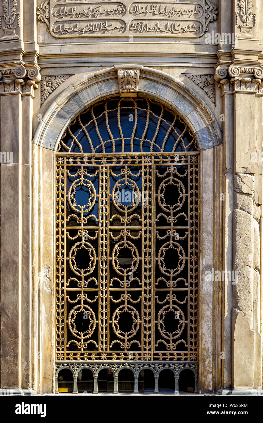 Exterior detail of bronze window grilles and carved marble reliefs at the Sabil wa Kuttab of Tusun Pasha, the second son of Muhammad Ali Pasha Stock Photo