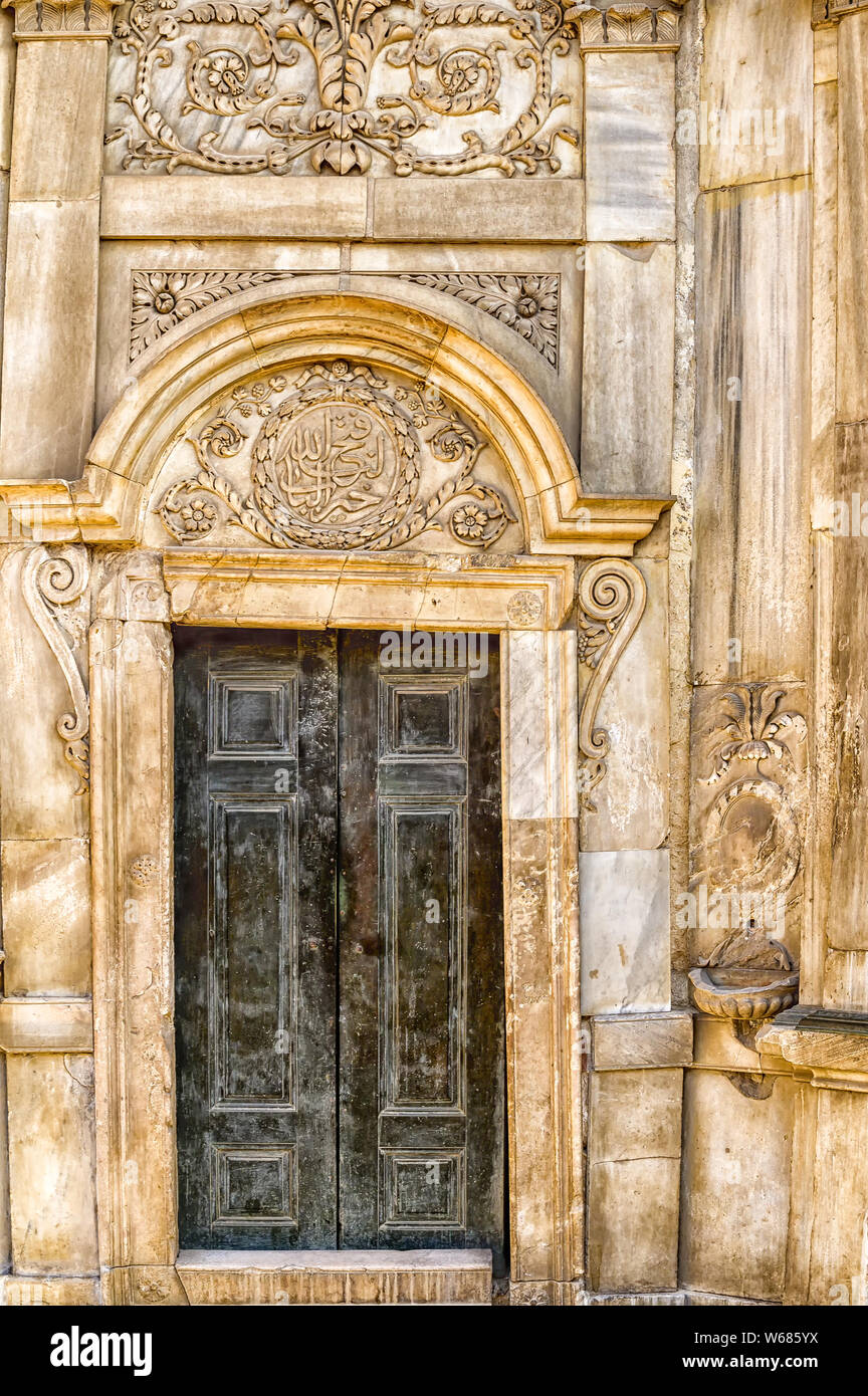 Ornate Entry door to the Historic Sabil wa Kuttab of Tusun Pasha, decorated with carved marble reliefs, located in Al-Muizz street Stock Photo