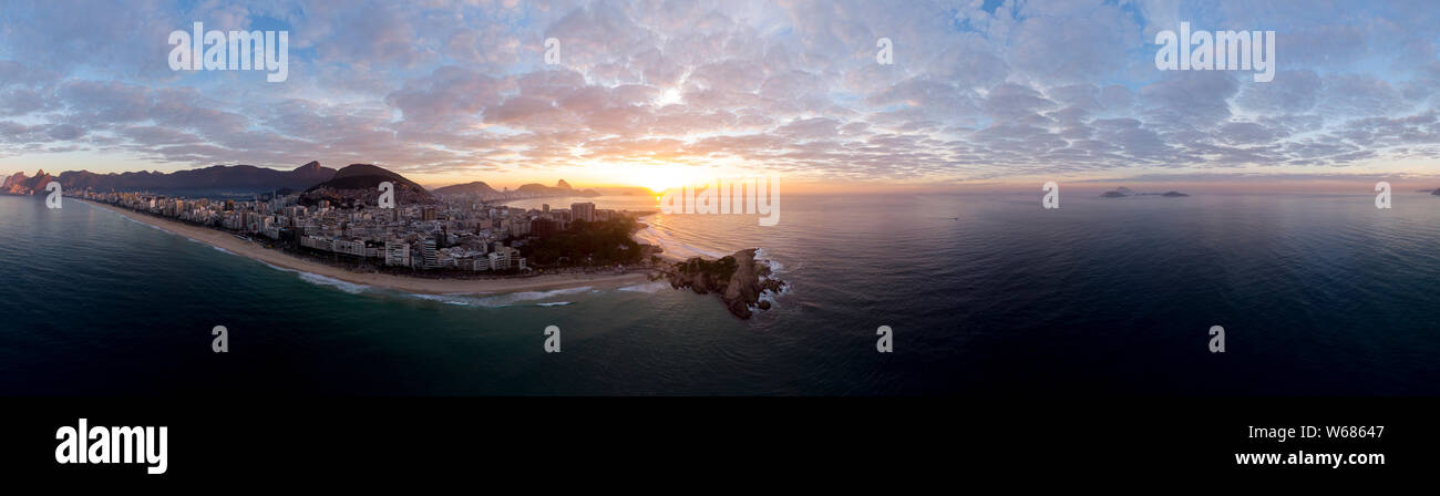 Sunrise 360 degree full panoramic aerial view of Rio de Janeiro with Arpoador and Ipanema beach in the foreground and the wider cityscape behind Stock Photo