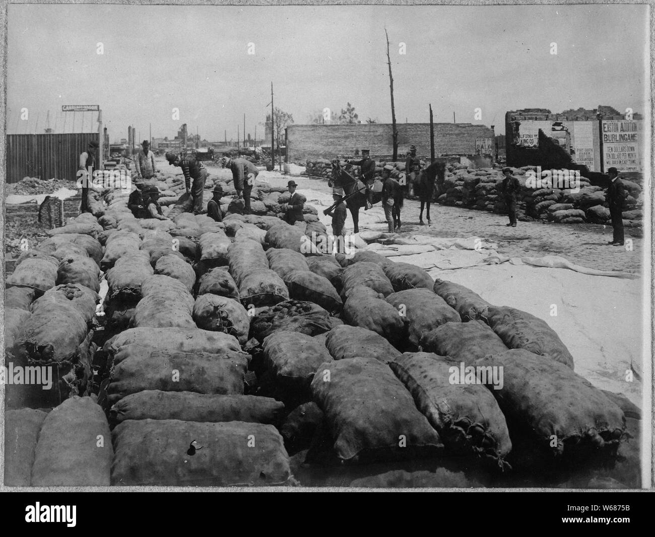San Francisco Earthquake of 1906: Restacking potatoes after the rain Stock Photo