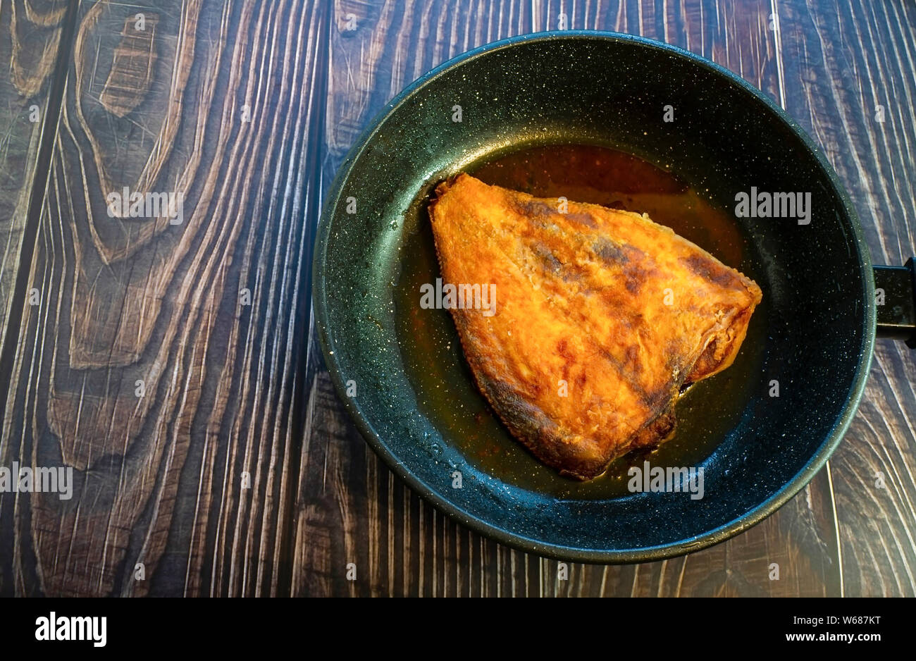 Fried flounder in a pan. Home cooking in a rustic style Stock Photo Alamy