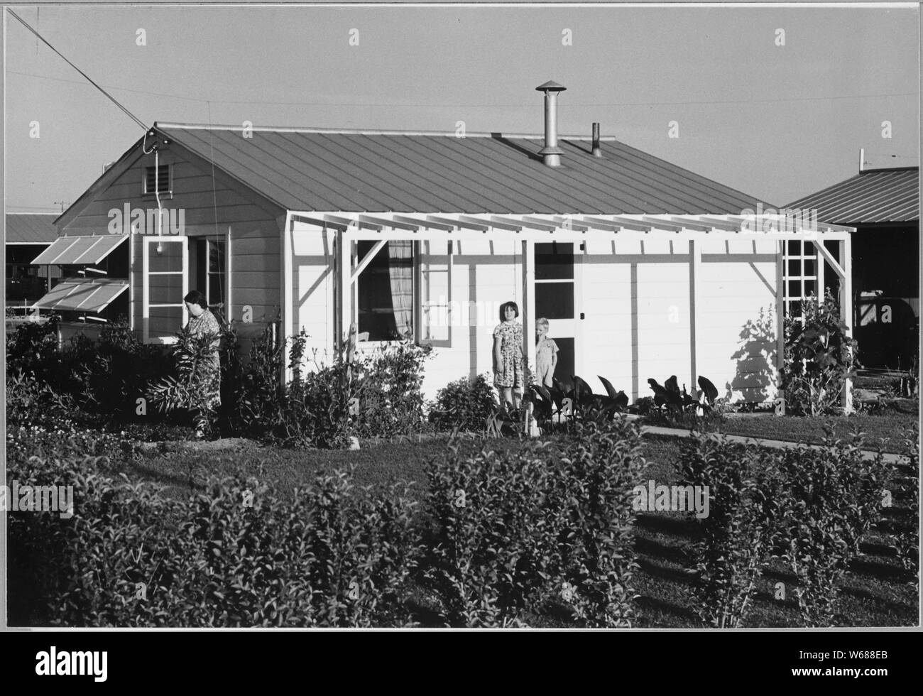 Shafter, Kern County, California. Another farm labor home in the Arvin Farm Workers Community (F.S.A . . .; Scope and content:  Full caption reads as follows: Shafter, Kern County, California. Another farm labor home in the Arvin Farm Workers Community (F.S.A.). These homes are designed for agricultural workers steadily employed in the District. Rent is $8.20 per month, which includes electricity. Stock Photo