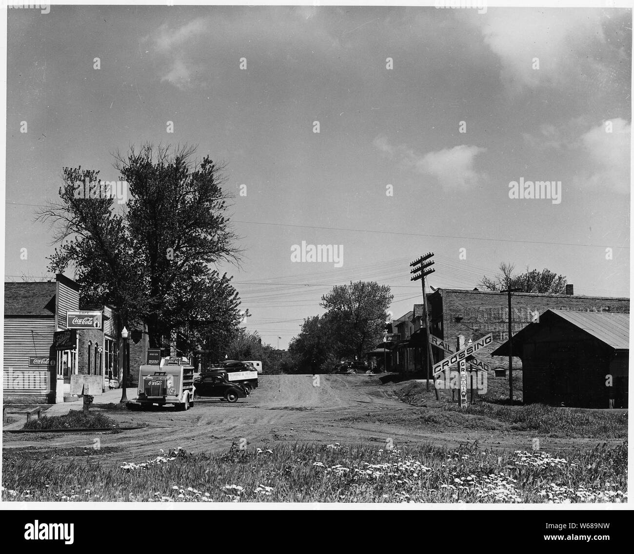 Shelby County, Iowa. The village of Irwin is the center of a community -- village and hinterland -- . . .; Scope and content:  Full caption reads as follows: Shelby County, Iowa. The village of Irwin is the center of a community -- village and hinterland -- including most of four townships. Its population, including both farm and village people, is about 1500. These pictures show Irwin's main street with its bank, post office, stores and offices. Farm people can buy most of what they need here in the village, but there are other and larger towns within easy driving distance whose stores are fa Stock Photo