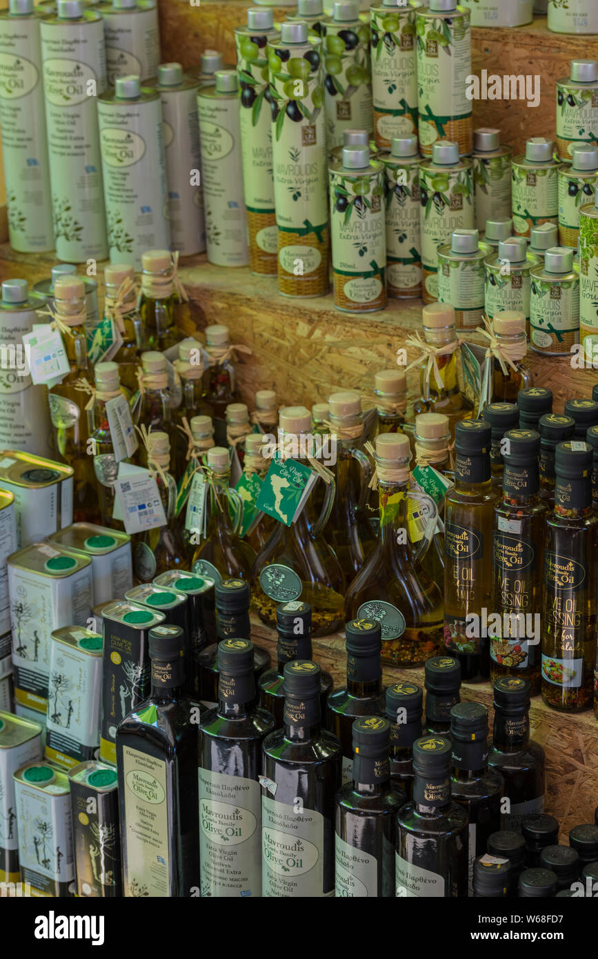 a quantity of bottled extra virgin olive oil for sale on a market stall for souvenirs in kerkyra, corfu, Greece. Stock Photo